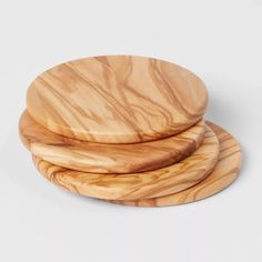 three wooden plates stacked on top of each other