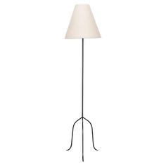 a black floor lamp with a white shade on the top and an iron rod base