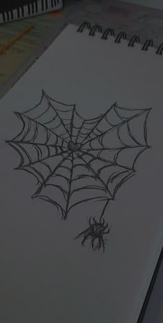 a drawing of a spider on a sheet of paper