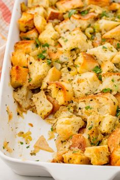 a casserole dish filled with bread and vegetables