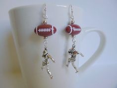 Great football earrings in 3 different styles.  These charms are made from a zinc alloy metal and the Brass Hook Ear wire is, Lead Free & Cadmium Free & Nickel Free. Sports Earrings, Football Jewelry, Football Diy, Football Earrings, Charms Earrings, Brass Hook, Bead Jewelry, Purse Charms, Key Chains