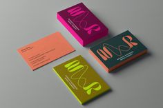 three different business cards on top of each other with the letter s and o in bold colors