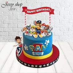 a birthday cake with paw patrol characters on it