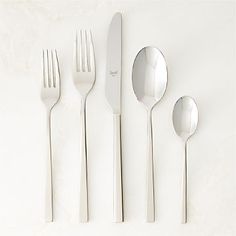 five forks, two spoons and one knife on a white surface