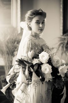 an old photo of a woman in a wedding dress