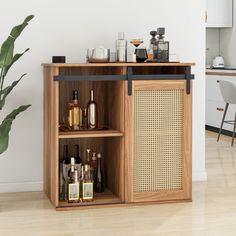 an open cabinet with liquor bottles on the shelf and a potted plant next to it