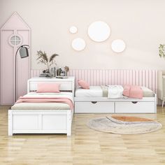 a bedroom with pink walls and white furniture