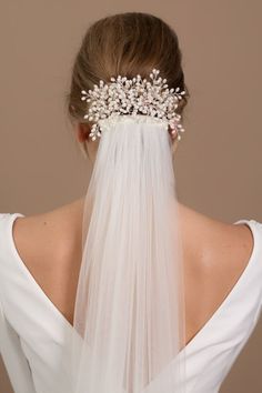 For a bridal hair comb that doesn't feel too traditional or too trendy, look for a classic style with a modern twist. Layers of small ivory seed pearl sprigs have been hand-wired onto a silver veil comb to add prettiness to your bridal veil. #weddingideas #bridalideas #weddinghairstyle #bridalhairstyle Hair Comb With Veil, Silver Veil, Veil Pearl, Veil Comb, Pearl Wedding Hair, Comb Veil