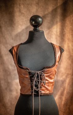 Steampunk Bodice Fake Leather Renaissance Corset Vest Dark - Etsy Gothic Festival Vest For Fall, Gothic Vest For Fall Festival, Gothic Sleeveless Vest For Costume Party, Gothic Underbust Corset For Fall, Fitted Steampunk Vest For Costume Party, Medieval Style Fitted Leather Corset, Medieval Leather Fitted Corset, Brown Steampunk Corset Dress For Costume Party, Fitted Leather Medieval Corset