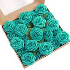 a box filled with blue cupcakes covered in frosting