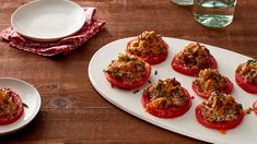 small stuffed tomatoes on a white plate