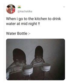 two people standing next to each other with their feet on top of the water bottles