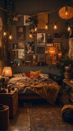 a bed room with a neatly made bed and lots of hanging pictures on the wall