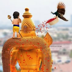 two children standing on top of a golden statue with birds flying over it and the back of their heads