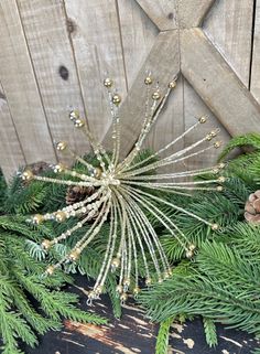 a close up of pine cones and needles on a christmas tree