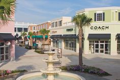 a fountain in the middle of a shopping district