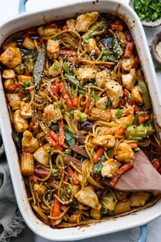 a casserole dish with chicken, noodles and veggies in it is ready to be eaten