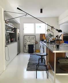 the kitchen is clean and ready to be used as a dining room or office space