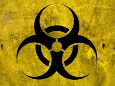 a yellow and black sign with a biohazard symbol on it's side