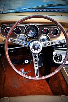 the interior of an old car with gauges and dash boards on it's dashboard