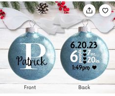 two christmas ornaments with the names and date printed on them