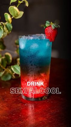 a drink sitting on top of a wooden table next to a green leafy plant