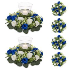 blue and white flowers are arranged around a candle