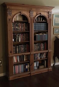 an old bookcase with many books in it