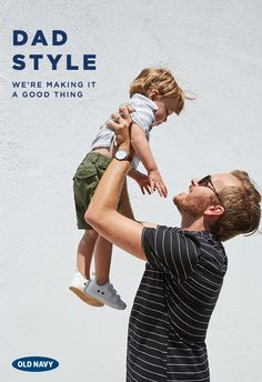 a man holding a child up to his face with the caption dad style we're making it a good thing