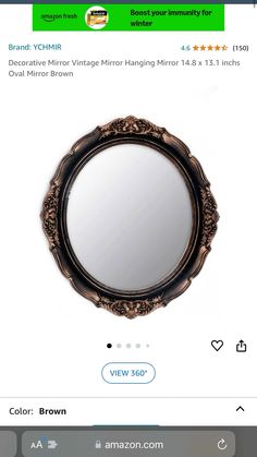 a mirror that is sitting on top of a table with an amazon gift card in front of it