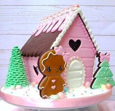 a gingerbread house decorated with icing and decorations