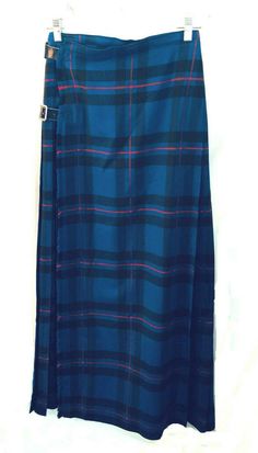 Wonderful genuine vintage wool maxi blue plaid tartan kilt from the 70's From the Scotch House, London. Unlined. VG condition-one VERY TINY hole towards the bottom of skirt that you definitely have to look for and is not obvious when worn. Sold AS IS. No size market so please see measurements for proper fit as all sales are final. measurements waist  26 hips  34-35 length  42 PLEASE READ BEFORE YOU BUY About the Vintage / Preowned clothes I sell: As a long time seller, I source specifically to r Scottish Skirt, Irish Kilt, Scottish House, Blue Plaid Skirt, Scottish Clothing, London Vintage, House London, Tartan Skirt, Tartan Kilt