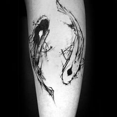 a black and white photo of a fish tattoo on the right thigh, with ink splatters all over it