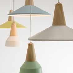 several different colored lamps hanging from the ceiling