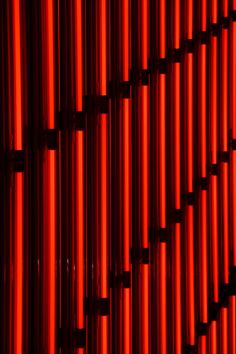 a red wall that has some kind of pattern on it