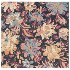 an area rug with flowers and leaves on it