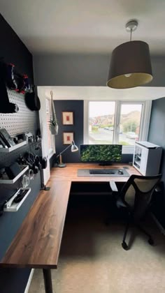 a home office with a desk and chair in the corner, next to a radiator