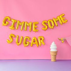 an ice cream cone and some balloons that say'gimme some sugar'on a pink background