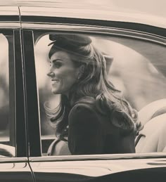 a woman sitting in the passenger seat of a car