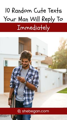 a man is texting on his phone while walking down the street