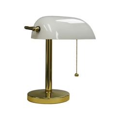 a white and gold desk lamp with a chain hanging from it's end on a metal base