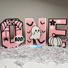 the word boo spelled out with halloween decorations