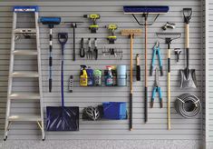 there are many tools hanging on the wall