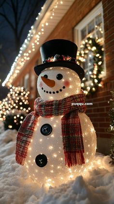 a snowman with a top hat and scarf