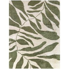 a green and white rug with leaves on it