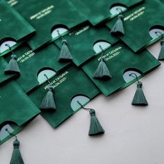 green tasselled envelopes with the names of different countries on them are laid out in rows