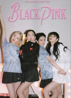 the girls are posing in front of a black and pink advertisement for their new perfume