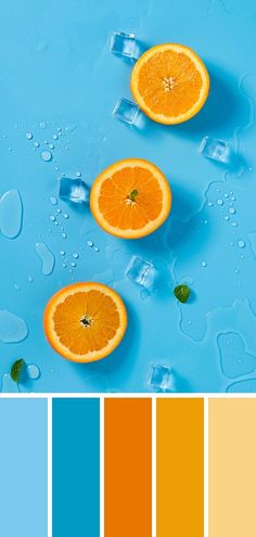 three oranges with ice cubes in the middle on a blue background, and one is