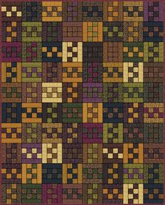 a quilt with many squares on it and one block in the middle is purple, green,