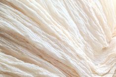 the texture of yarn is white and beige